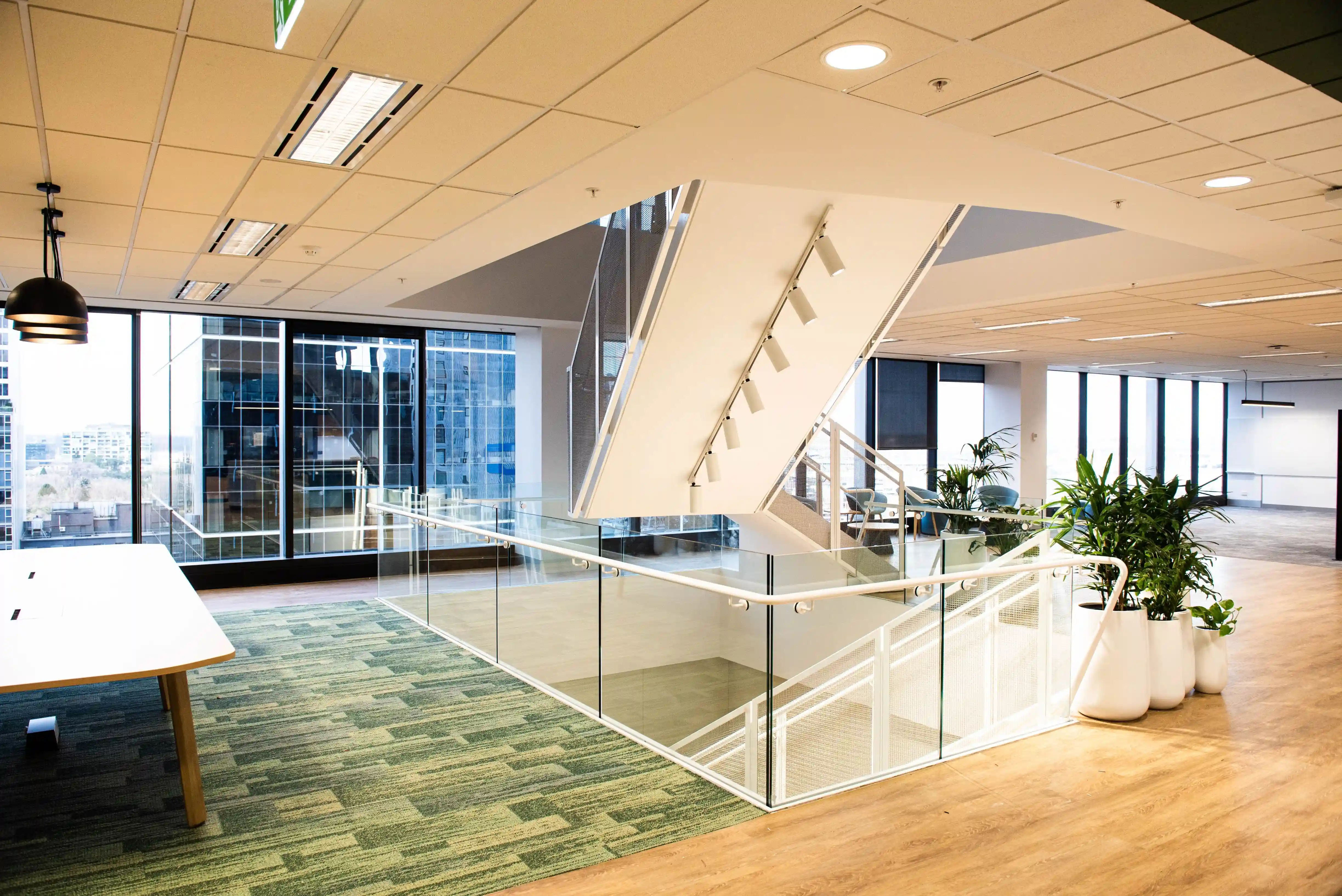 Melbourne CBD office fit-out — glass balustrades and floor-to-ceiling facade glazing