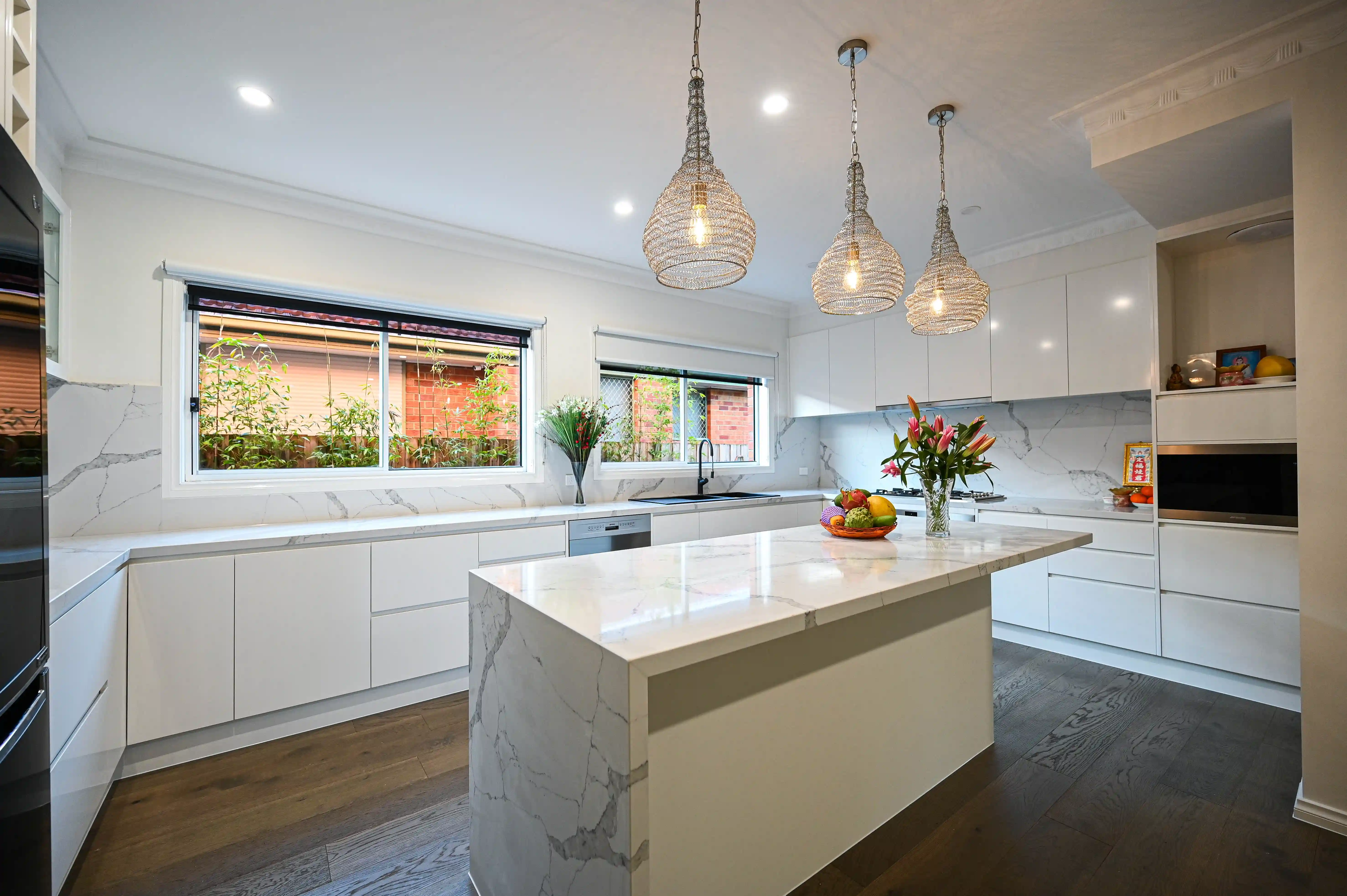Sunshine North kitchen — white aluminium sliding windows above counter